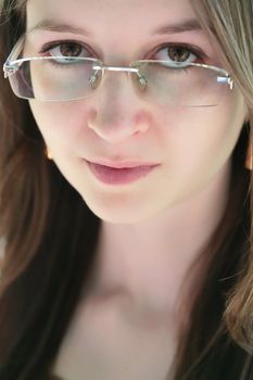 glance of the young girl over glasses