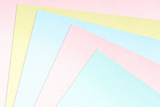 Color paper samples in various colors as background.