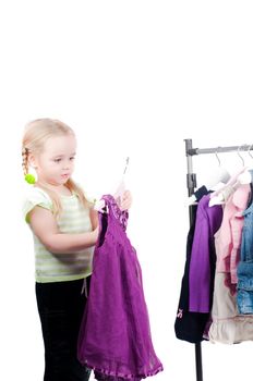 Shot of cute toddler girl choosing clothes