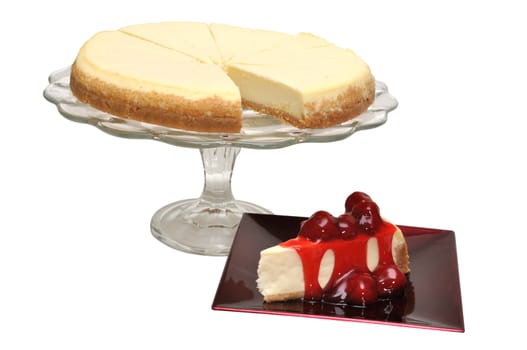 Strawberry cheesecake slice with whole cheesecake isolated on white background with clipping path.