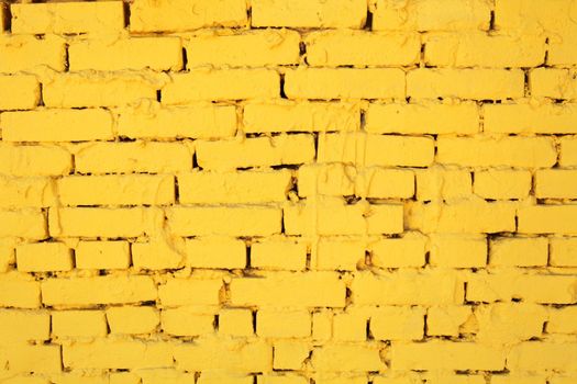 background, texture, aging wall from brick dyed yellow color