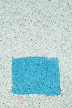 background, fragment concrete wall with blue rectangle and copy-space