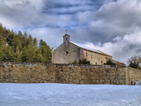 HDR image of the Provence chapel of Saint-Valvert in a snowy landscape of Vergons-en-Provence