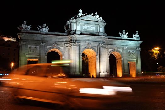 Madrid, Spain. Night scene at Plaza de la Independencia, Puerta de Alaca, famous tourist attraction.