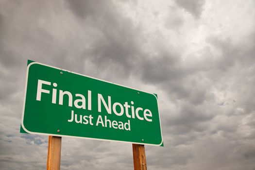Final Notice Just Ahead Green Road Sign with Dramatic Storm Clouds and Sky.