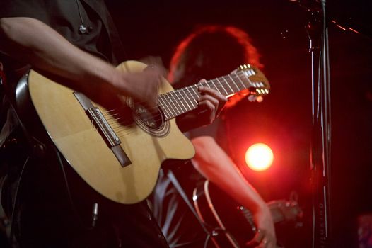 Two guitarists on live concert