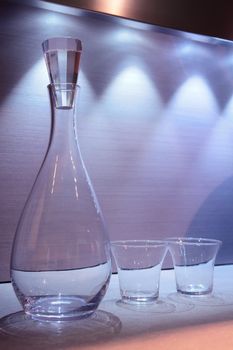 light-blue still life, glass carafe and two transparent glasses
