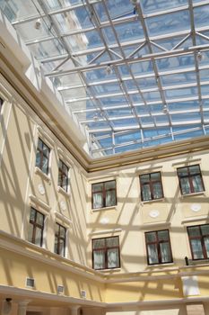 abstraction, interior of the building in classical style with pillar and glass ceiling