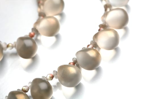 Fragment of the luxurious necklace, translucent beads to look like dripped