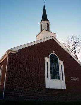 Classic Christian Church Steeple against blue sky