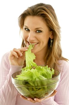 attractive caucasian woman eating lettuce