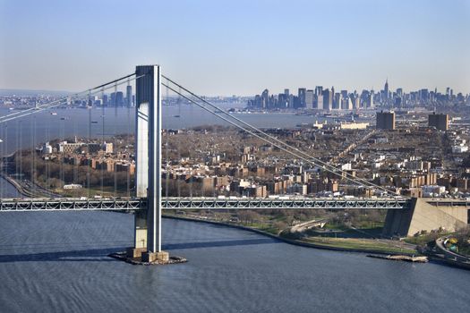 Aerial view of New York City's Verrazano-Narrow's bridge with Manhattan skyline.