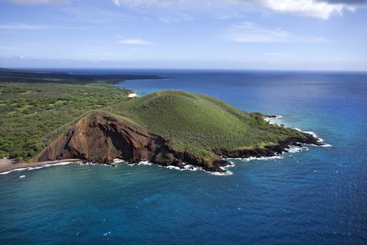 Aerial of Maui, Hawaii coastline with crater and cliffs on Pacific ocean.