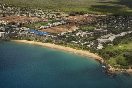 Aerial of Maui, Hawaii coastline with buildings and beach.