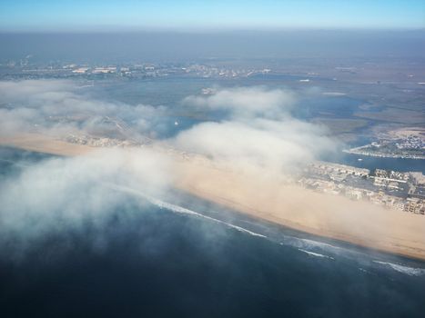 Aerial view of clouds covering beachfront in Southern California.