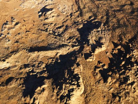 Aerial view of barren arrid desert landscape.