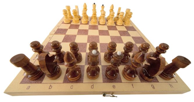 Wooden chess-men on the board on white 