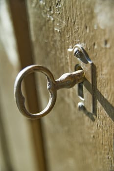 Key in a keyhole of an antiquarian case