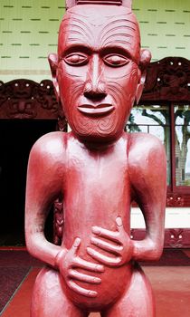 Maori Wood Statue carving outside the meeting house on the treaty grounds 