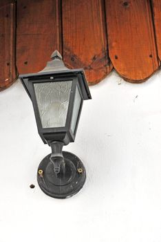 old lamp on house wall
