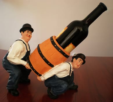 wine bottle holder with two men and cask