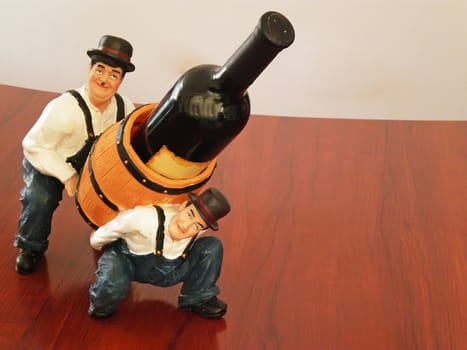 wine bottle holder with two men and cask