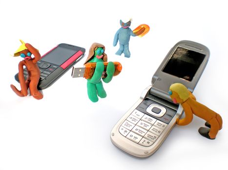 plasticine people figures with phones and usb flash on white background