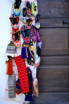 colorful hand-knitted slippers on a street market