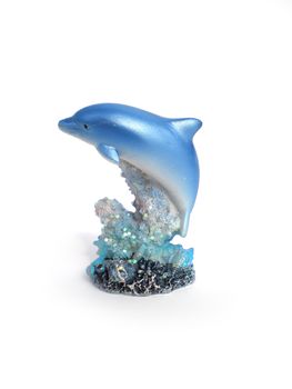 dolphine statue over corals isolated on white background