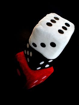 red, white and black dice up in a column