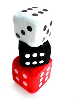 red, white and black dice up in a column