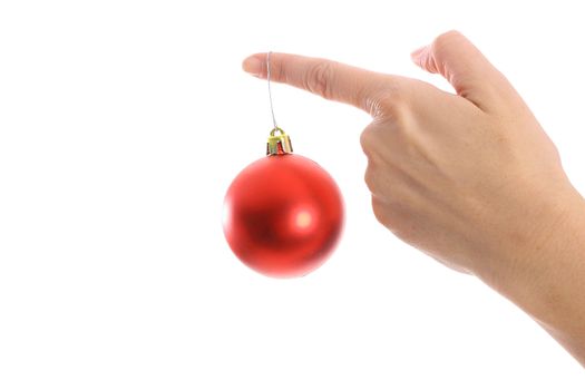 ornament hanging on womans finger