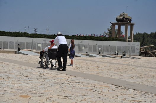 People pay tribute to fallen soldiers in Israel, a memorial monument in Latroun.