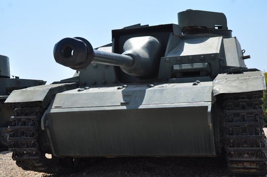 Old tank against the blue sky . Israel, Latrun.