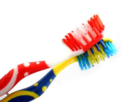 red and blue toothbrush isolated on white background