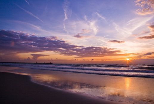 The beautiful blue and orange colors of a sunset at the beach