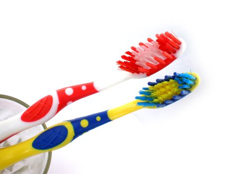 red and blue toothbrush isolated on white background