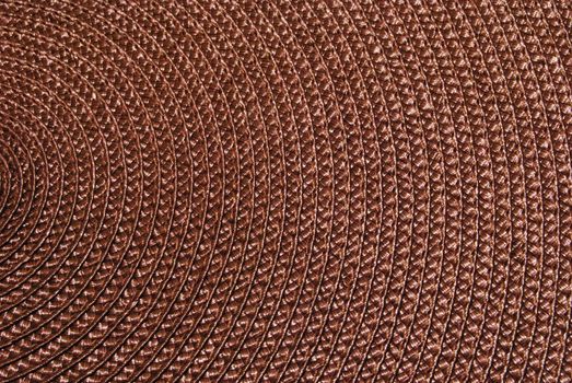 Texture of round wicker paper table napkin.