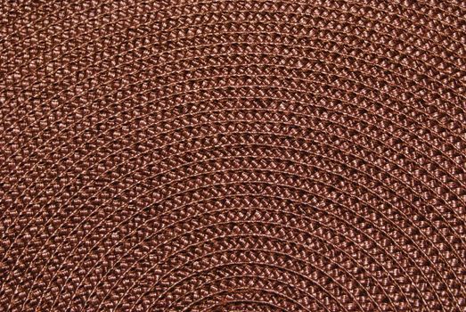 Texture of round wicker paper table napkin.