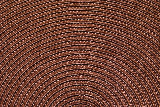 Texture of round wicker paper table napkin.