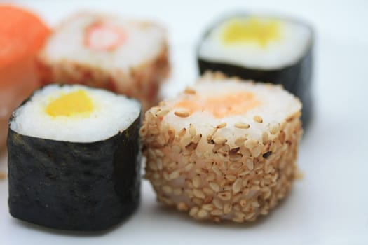 traditional Japanese sushi, rolled in seaweed, made from different sorts of raw fish