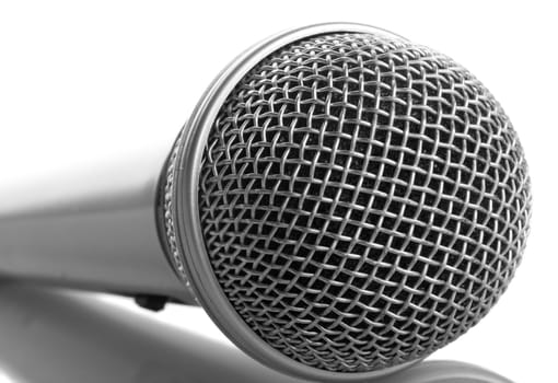 close-up silver microphone with reflection, isolated on white