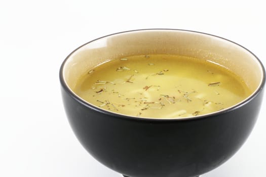 A bowl of hot soup served in an oriental bowl.
