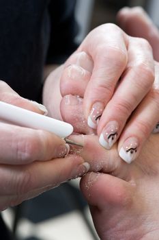 Foot therapist working on a mans feet