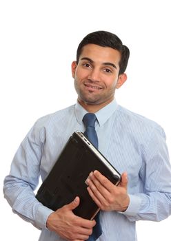 A smiling IT consultant, technician or salesman holding a laptop computer.  White background,