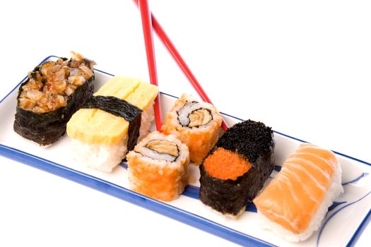 Isolated image of sushi with chopsticks.