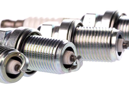 Isolated image of new spark plugs.
