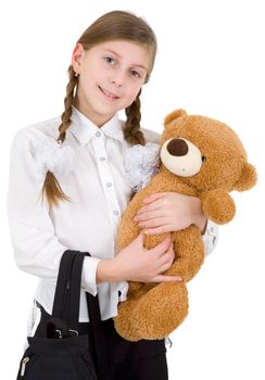 Schoolgirl with bear on a white background