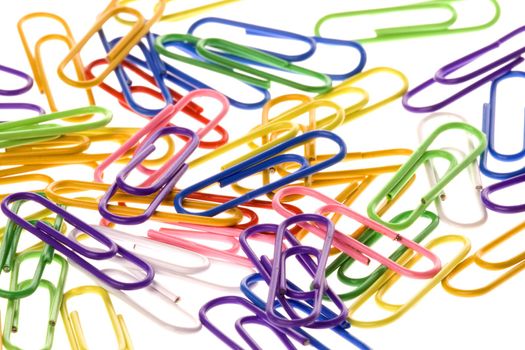 Isolated macro image of colourful paper clips.