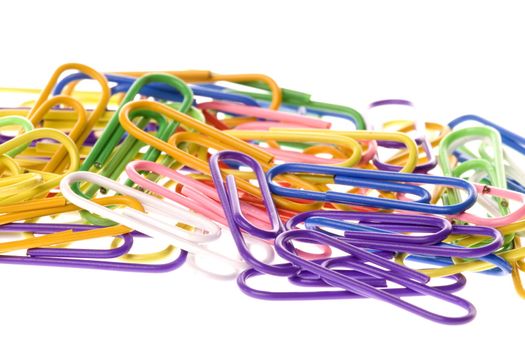 Isolated macro image of colourful paper clips.